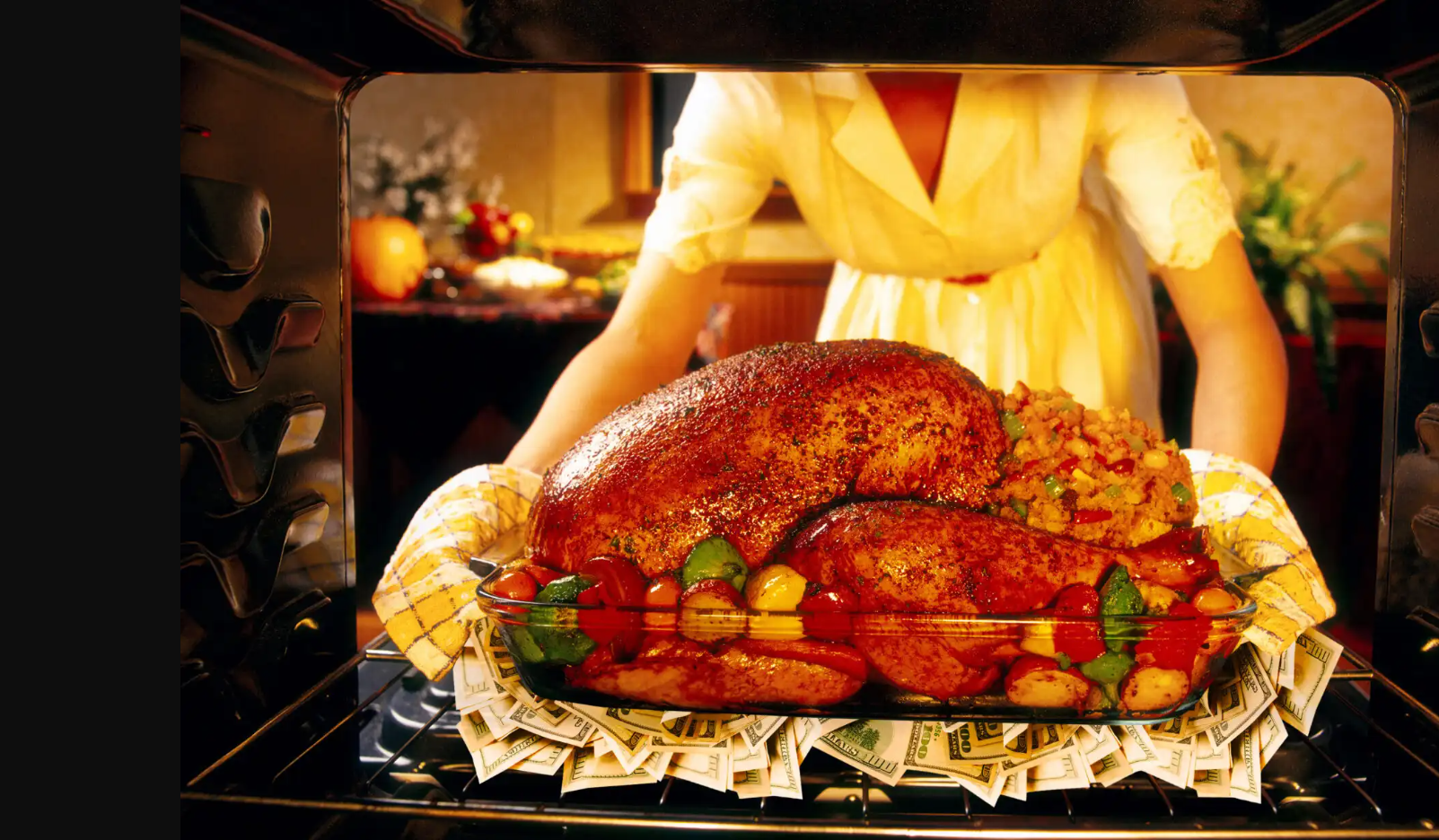 Image of Thanksgiving Turkey atop pile of $100 bills